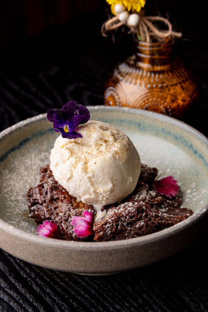 Cardamom chocolate brownie Leeds with vanilla ice cream
