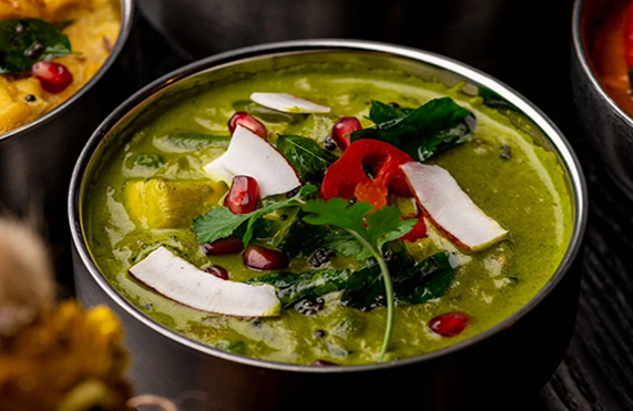 Modern South Indian green curry with fresh herbs and coconut