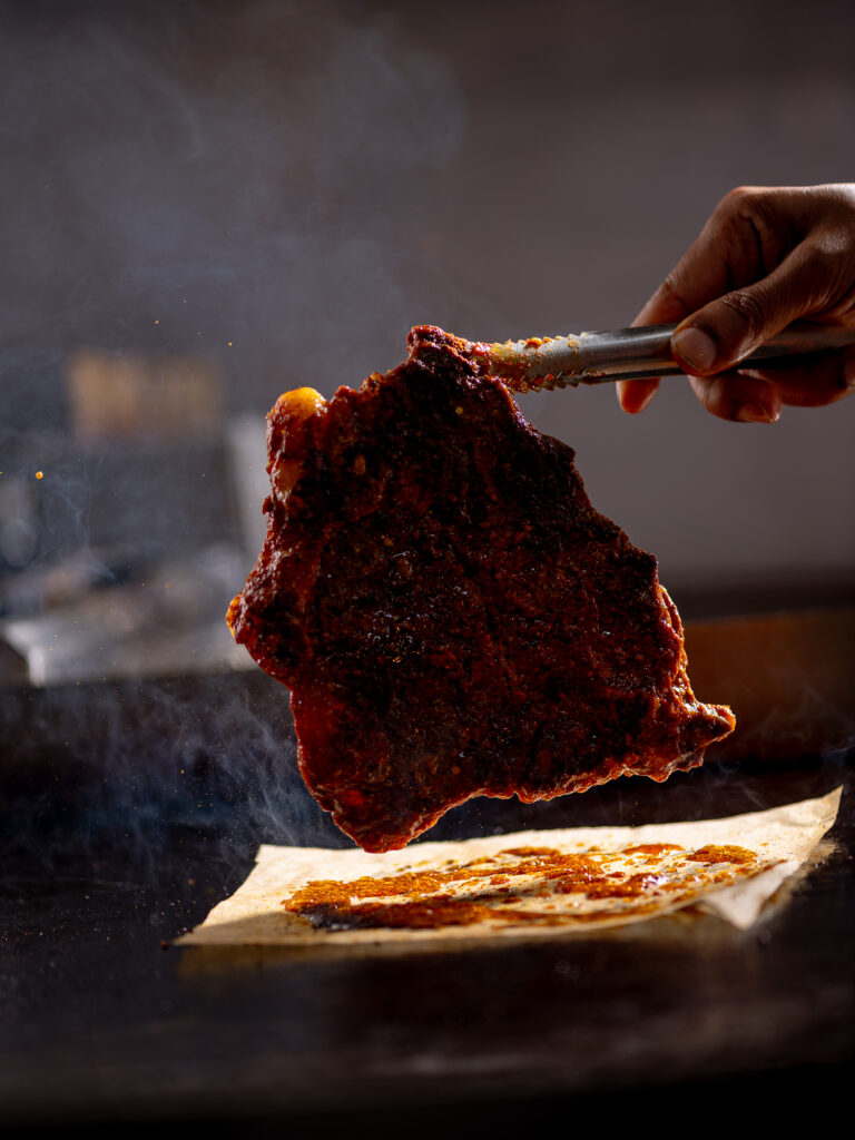 T bone steak Indian style Leeds with beef bone marrow curry and baby potatoes