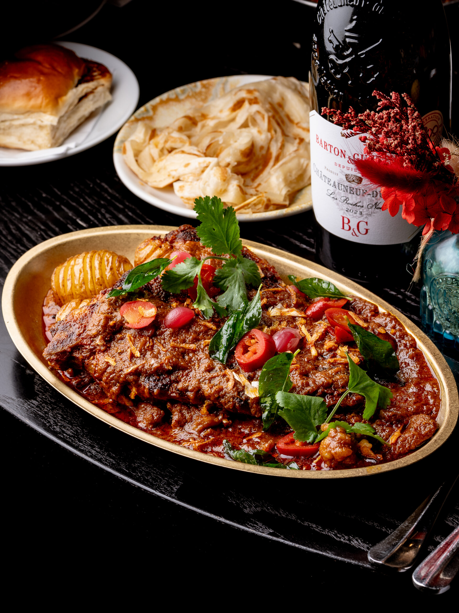 T bone steak Indian style Leeds with beef bone marrow curry and baby potatoes