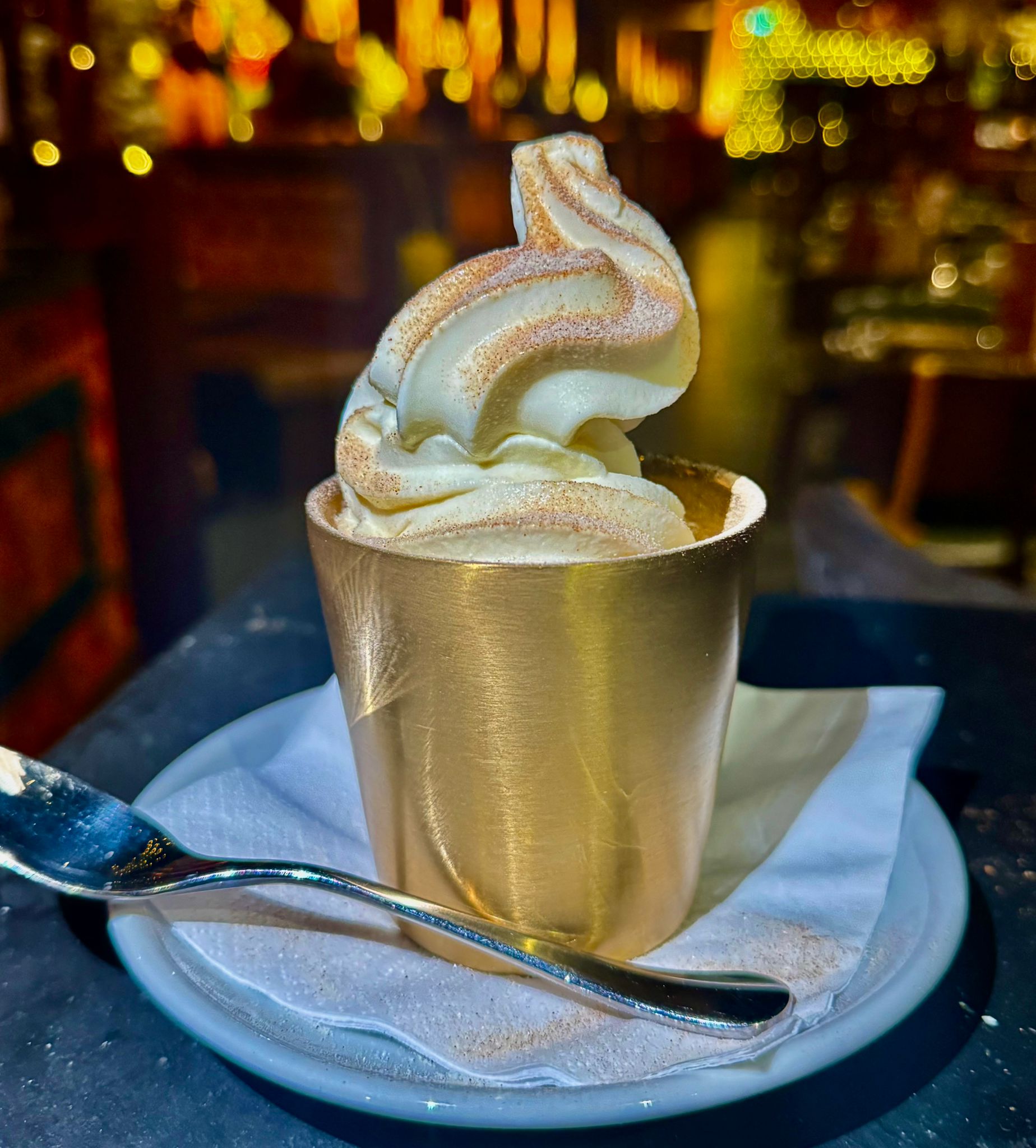 Chai spiced soft serve ice cream served in a brass tea cup at Kerala Canteen Leeds