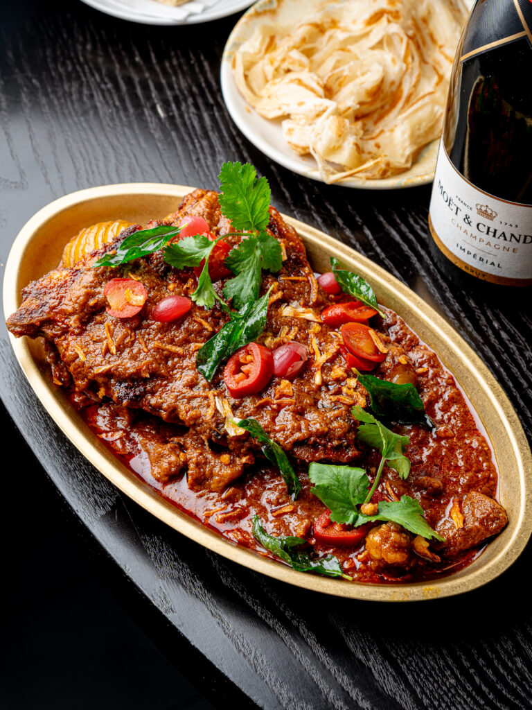 16oz slow-braised and grilled T-bone steak served with Kerala beef and bone marrow curry at Kerala Canteen Leeds