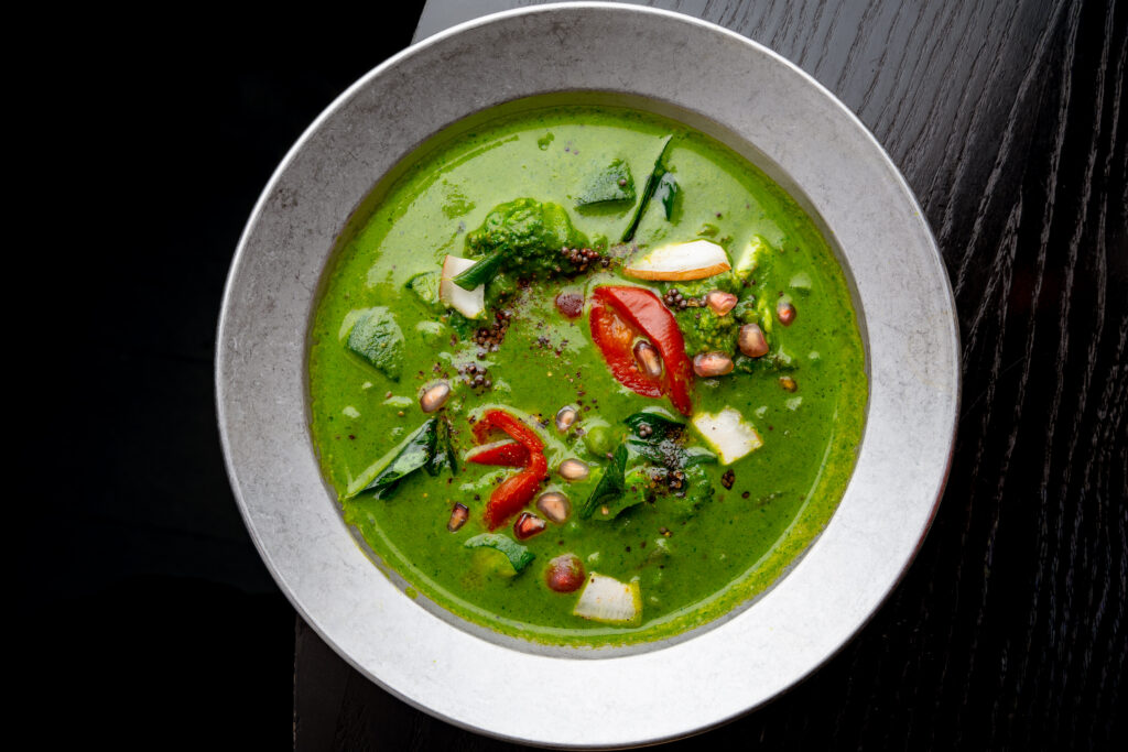 Green Seasonal Vegetable Korma at Kerala Canteen Leeds with broccoli peas beans and courgettes in Nilgiri Kerala sauce