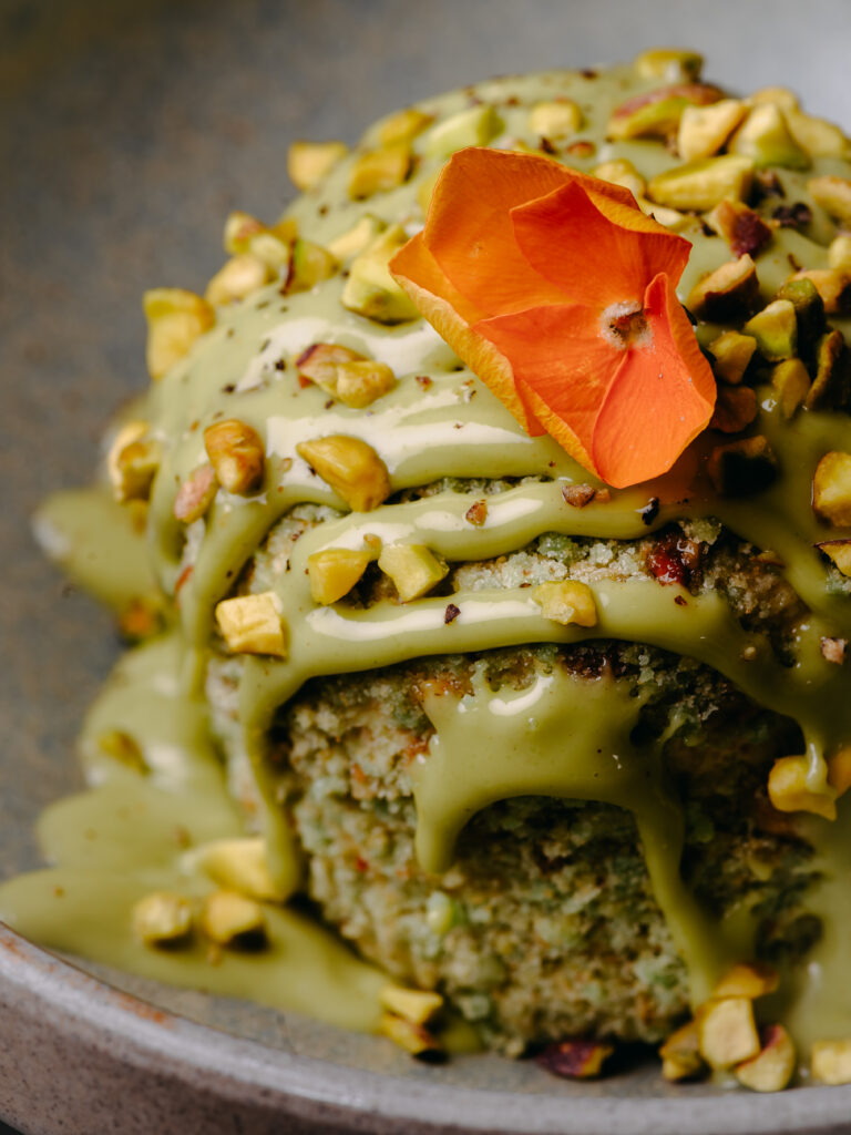 Pistachio and Pepper Semifreddo at Kerala Canteen Leeds topped with pistachio sauce and pistachio nibs.