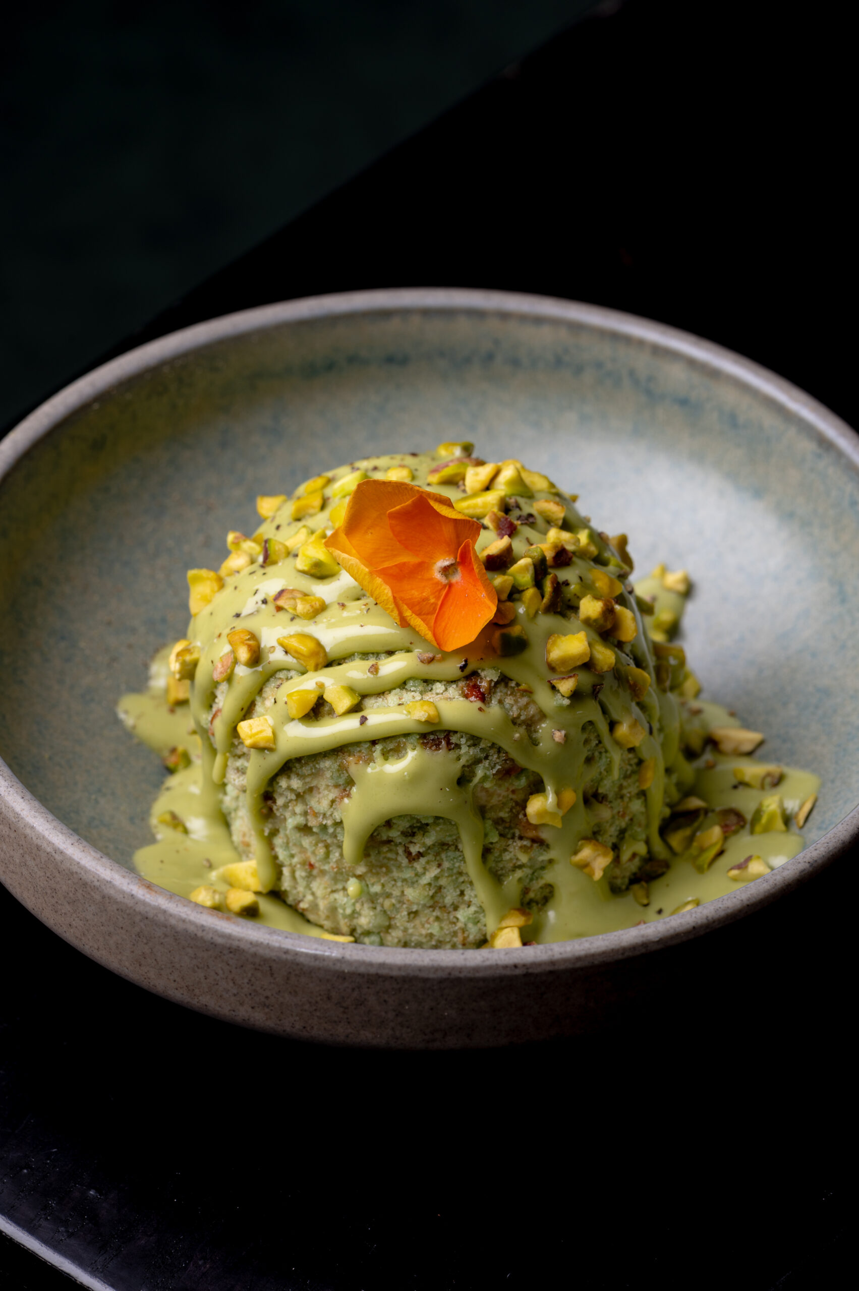 Pistachio and Pepper Semifreddo at Kerala Canteen Leeds topped with pistachio sauce and pistachio nibs.