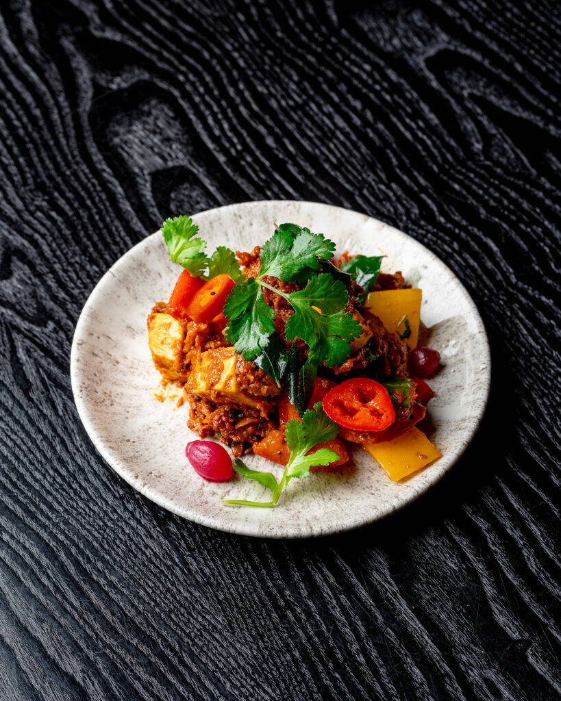 Paneer Pepper Fry with black pepper masala and pickled onions at Kerala Canteen Leeds
