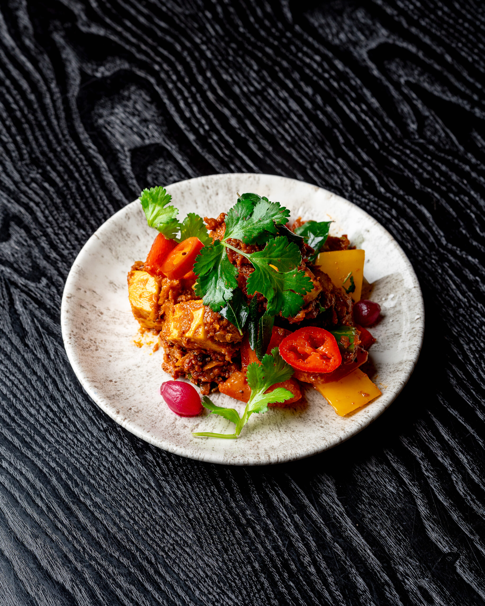 Paneer Pepper Fry with black pepper masala and pickled onions at Kerala Canteen Leeds
